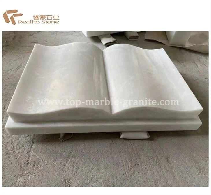 white-marble-monument-hand-and-book white-marble-monument-hand-and-book